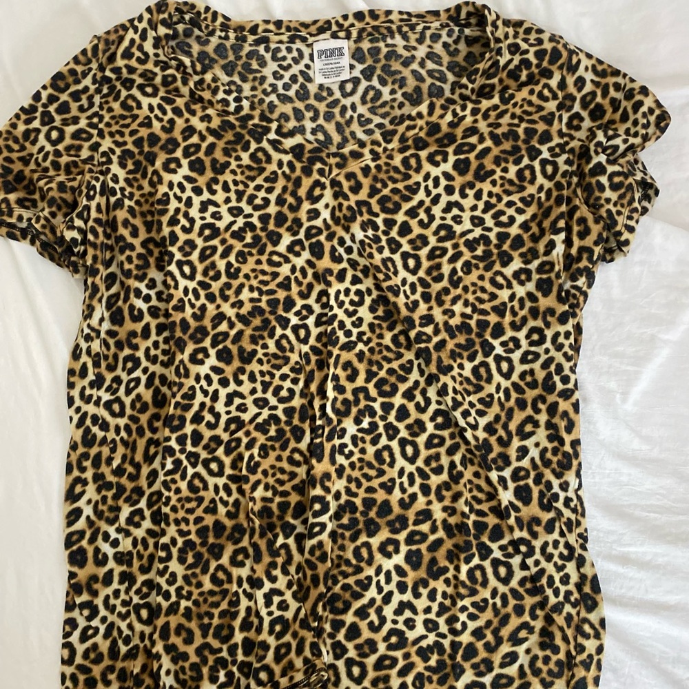 Pink cheetah shirt.
